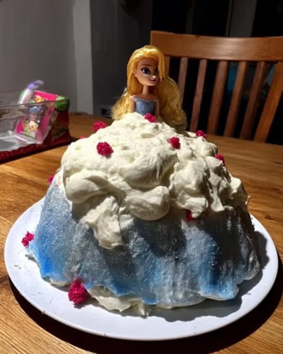 Ingredients for barbie cake including yellow cake mix frosting and a pyrex bowl