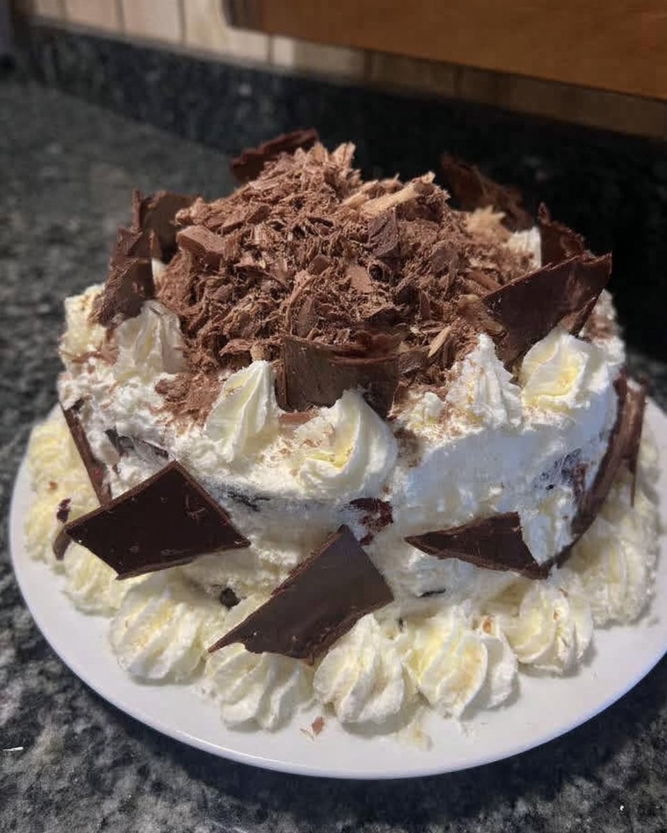 Black Forest Cake 13 Mixing cherry pie filling with cherry liqueur in a bowl