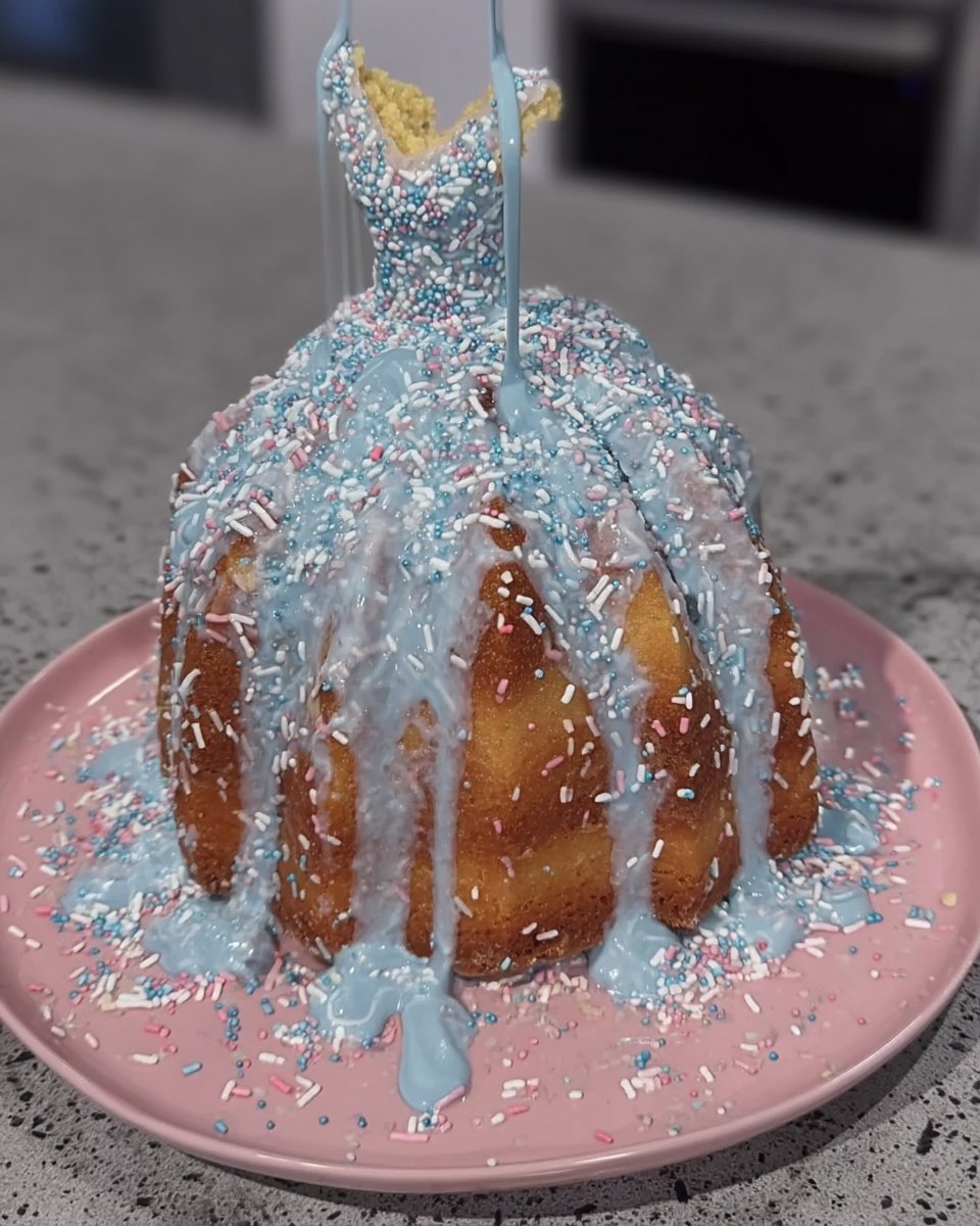 Carving cake layers into a skirt shape with a serrated knife