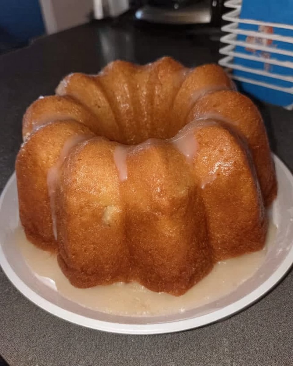 Slice of classic lemon pound cake on a white plate