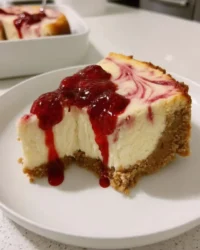 Slice of classic strawberry cheesecake with fresh topping
