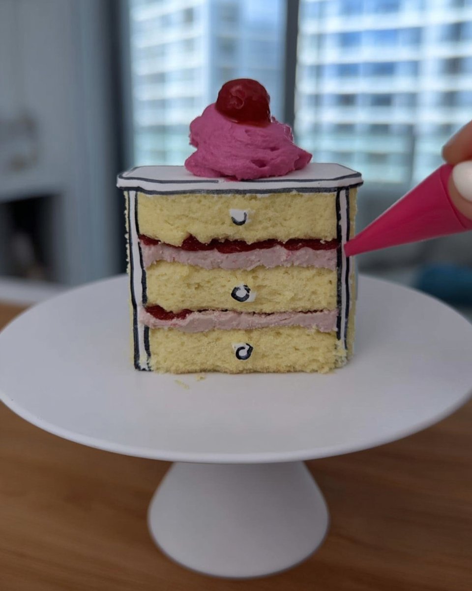 Slice of comic cake 2D style with black outlines and pink frosting