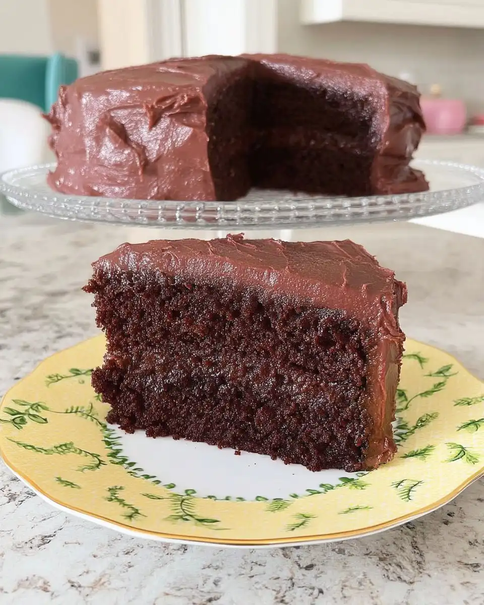 Whole frosted Devil's Food cake on a cake stand