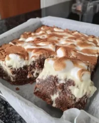 Slice of earthquake cake showing cream cheese swirl and pecan crust