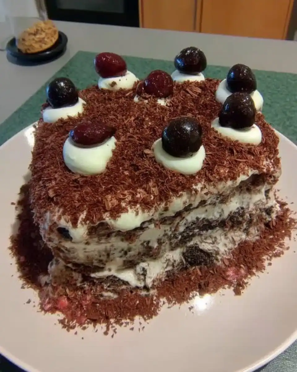 Frosting a chocolate layer cake with whipped ganache