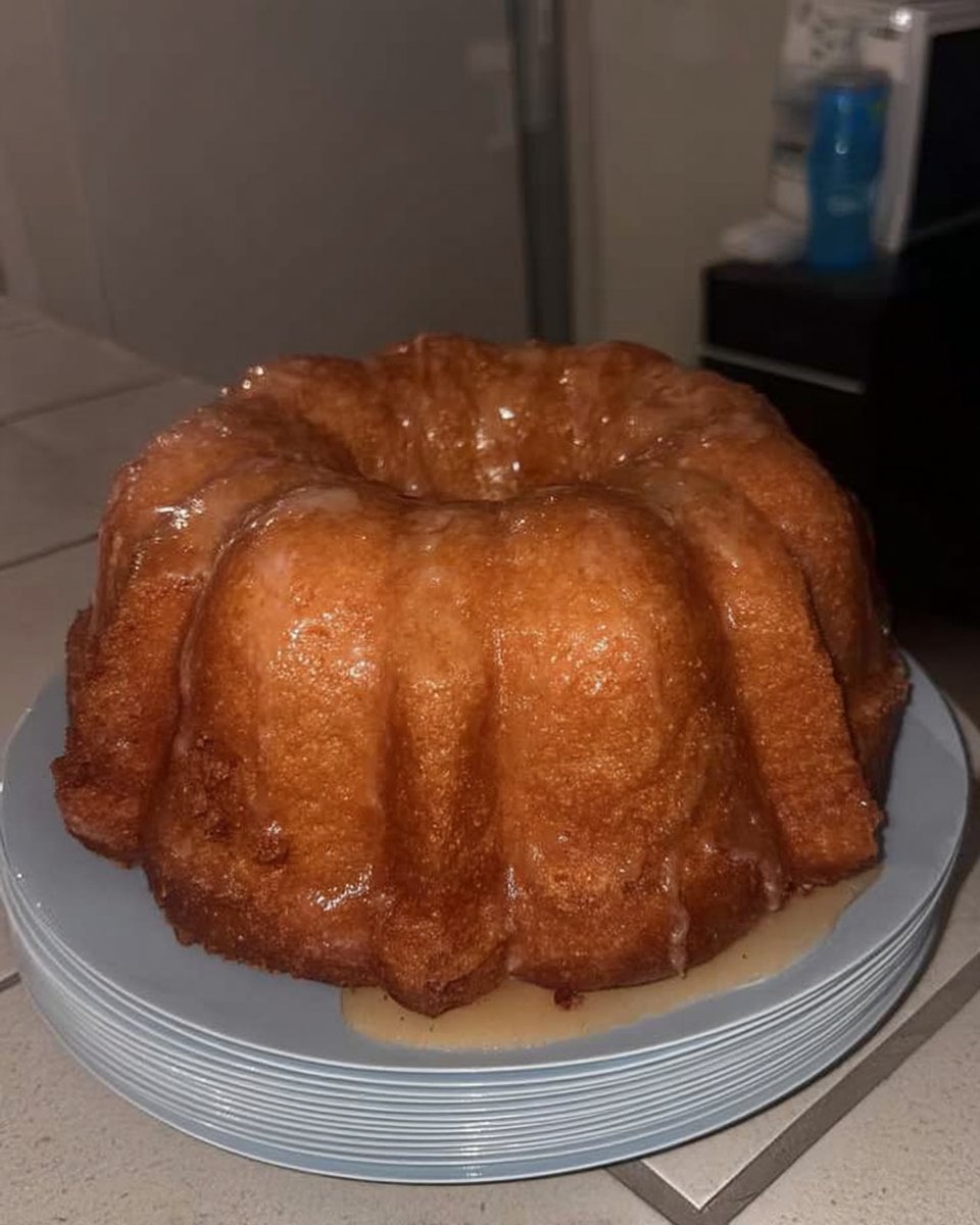 Glazed lemon bundt cake cooling on a wire rack