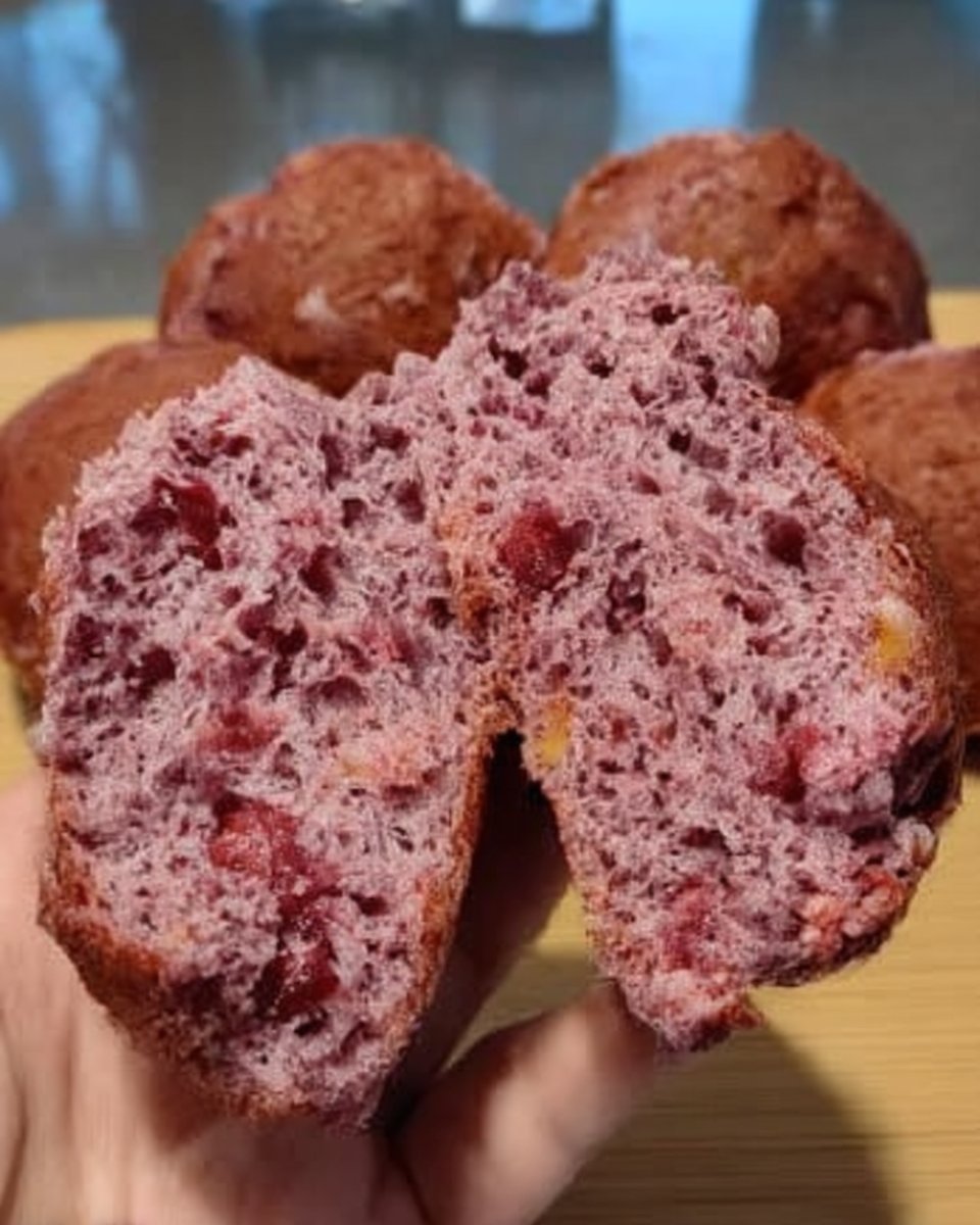 Finely grated purple carrots in a bowl with lemon zest