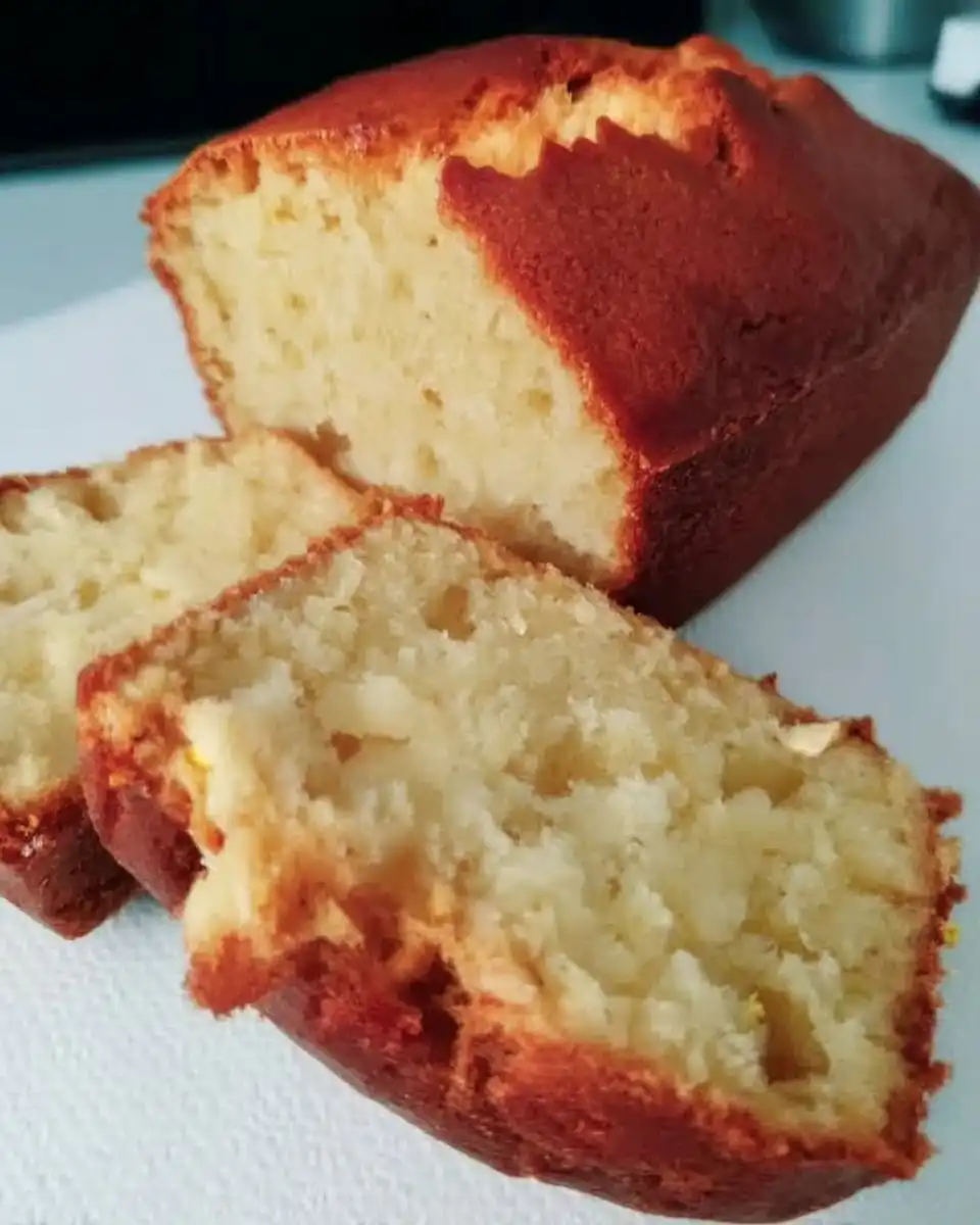Ingredients for lemon yogurt cake including butter sugar eggs and yogurt