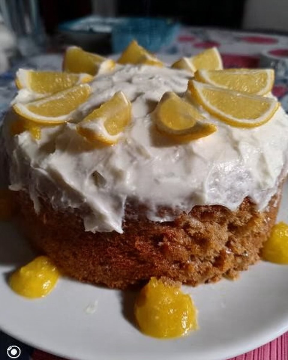 Whisking lemon cake batter in a large mixing bowl