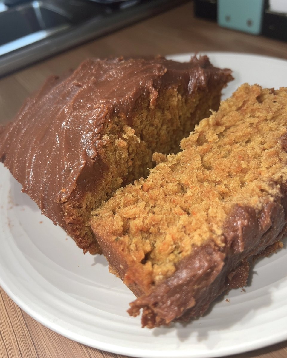 Tomato Soup Cake 13 Orange cake batter being mixed in a bowl