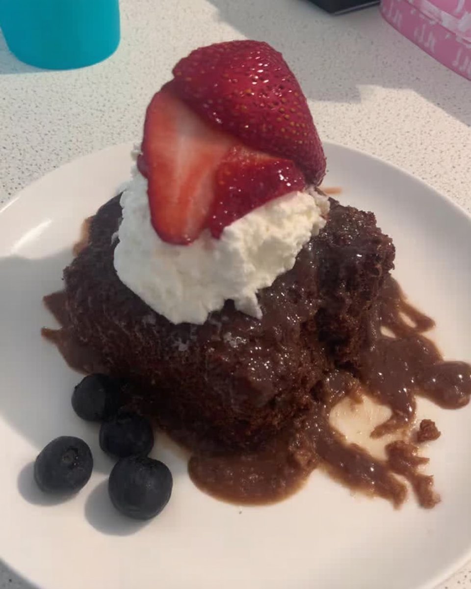 Whole Nutella cake with Kinder Bueno topping on a stand