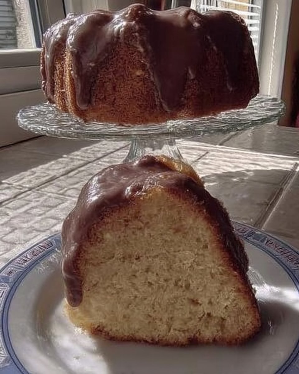 Thick vanilla cake batter in a mixing bowl