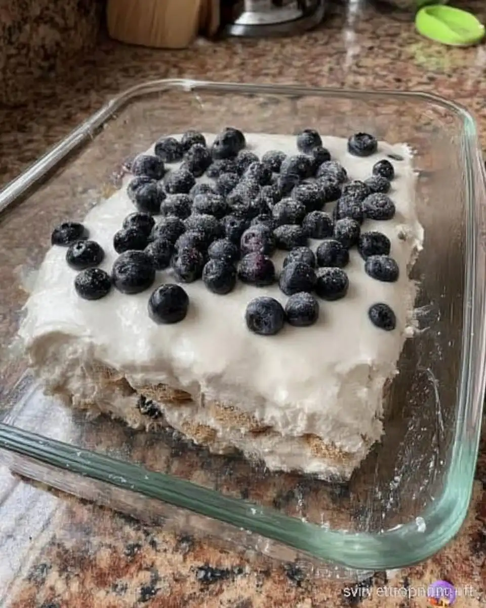 Serving a square of chocolate strawberry icebox cake on a plate