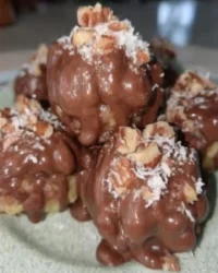 Simple yellow cake balls dipped in white chocolate with rainbow sprinkles