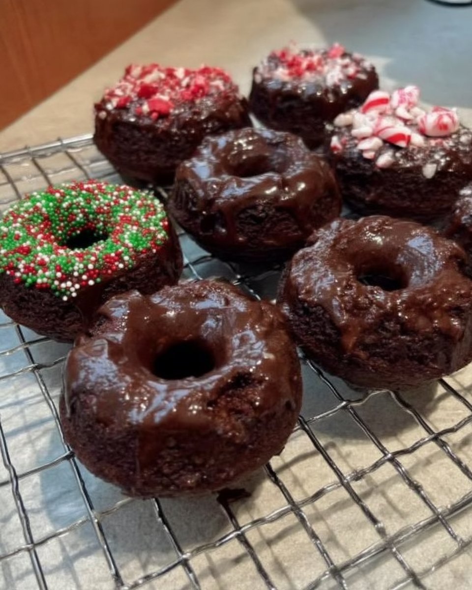 A slice of peppermint chocolate cake on a white plate with a fork