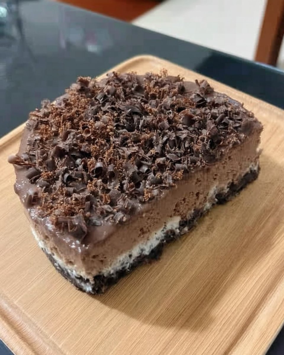 Chocolate cheesecake served with fresh raspberries