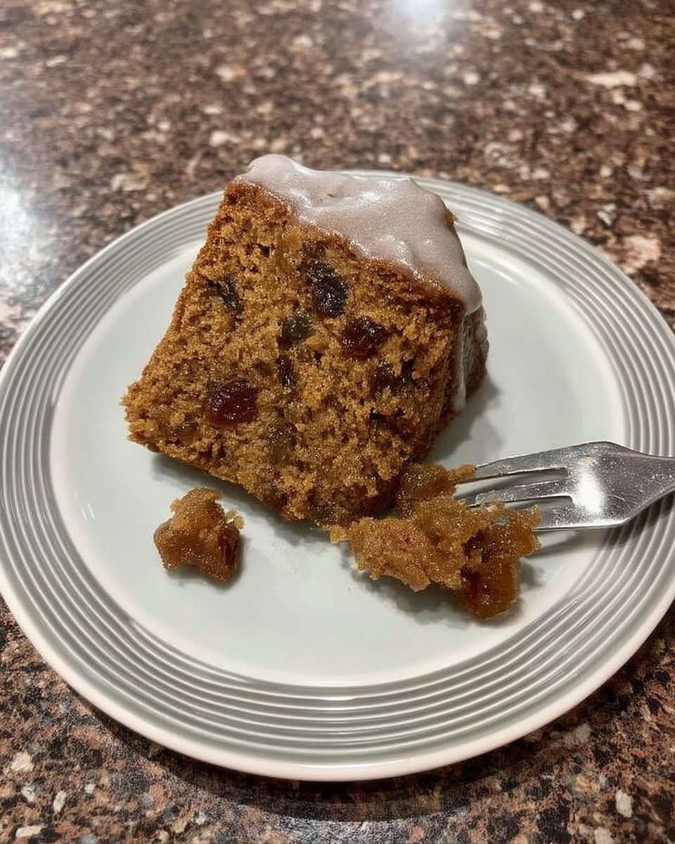 Thin slices of fruitcake served on a white plate