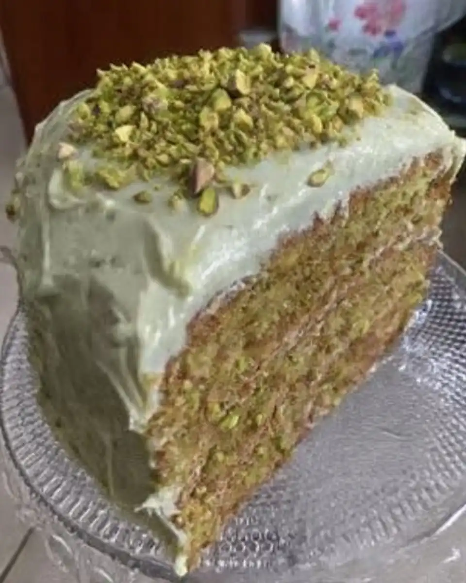 Watergate cake in a baking pan with a slice removed