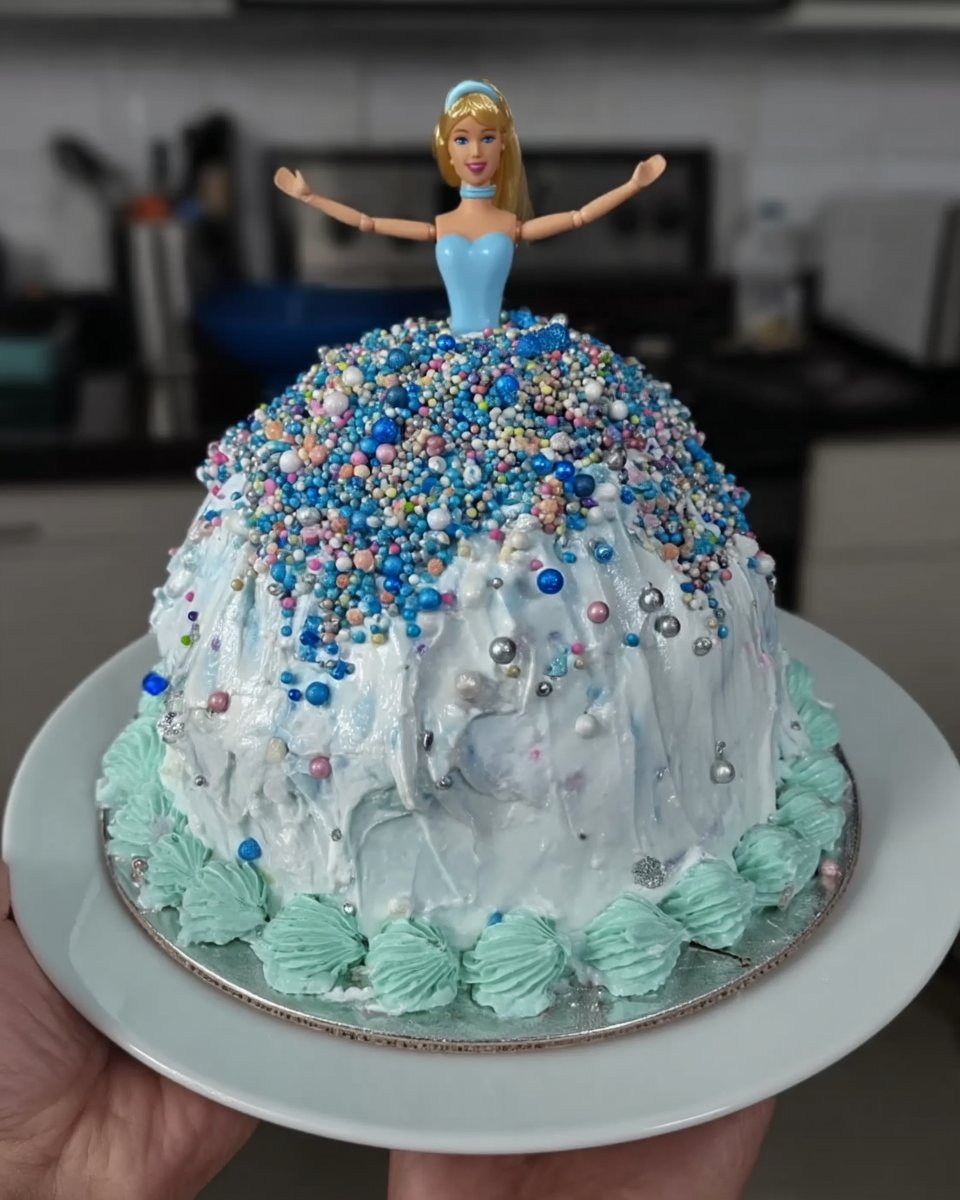 Slice of princess tsunami cake on a plate
