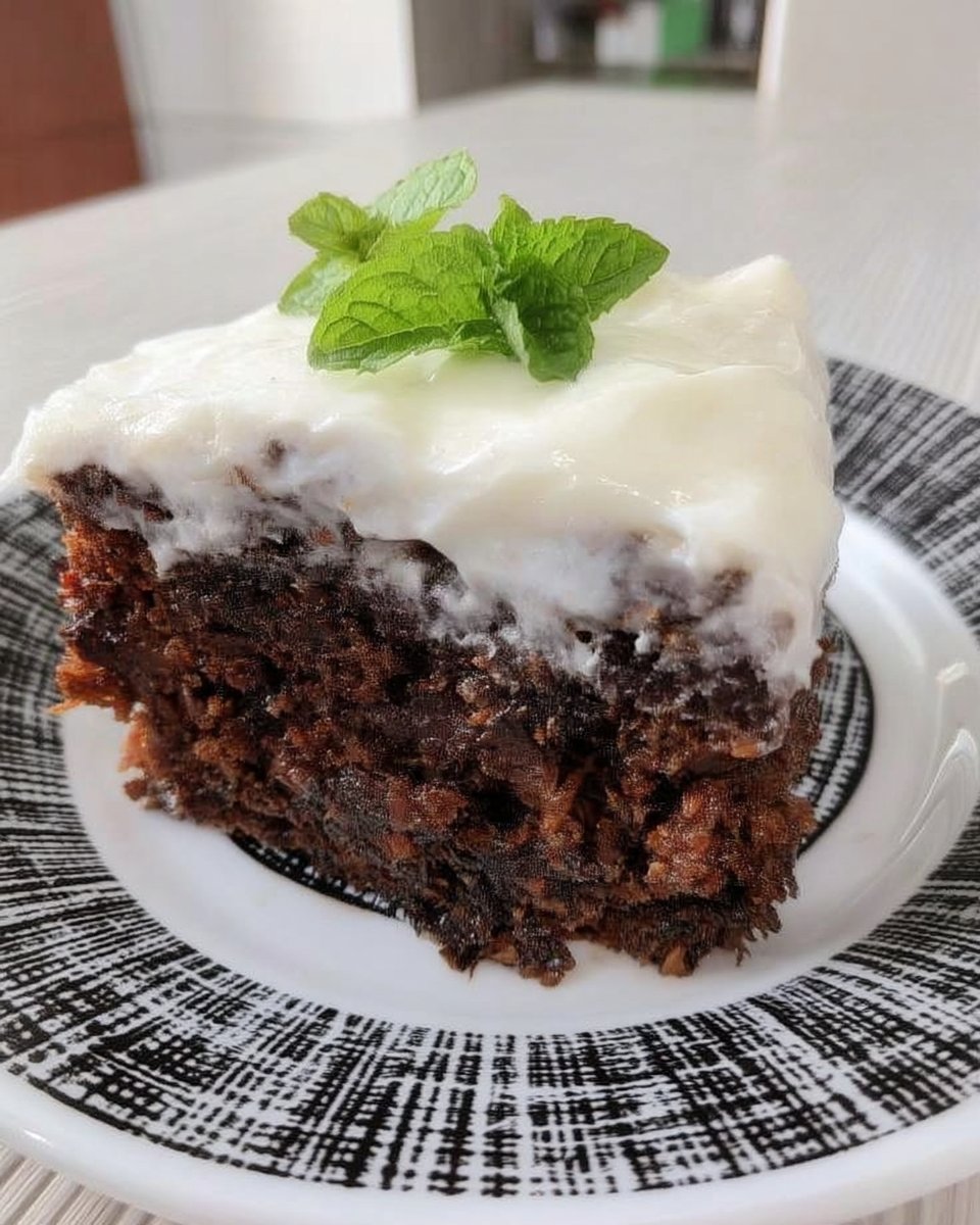 Slice of moist tomato soup cake with cream cheese frosting