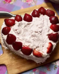 Heart shaped valentines cake with fresh strawberry buttercream