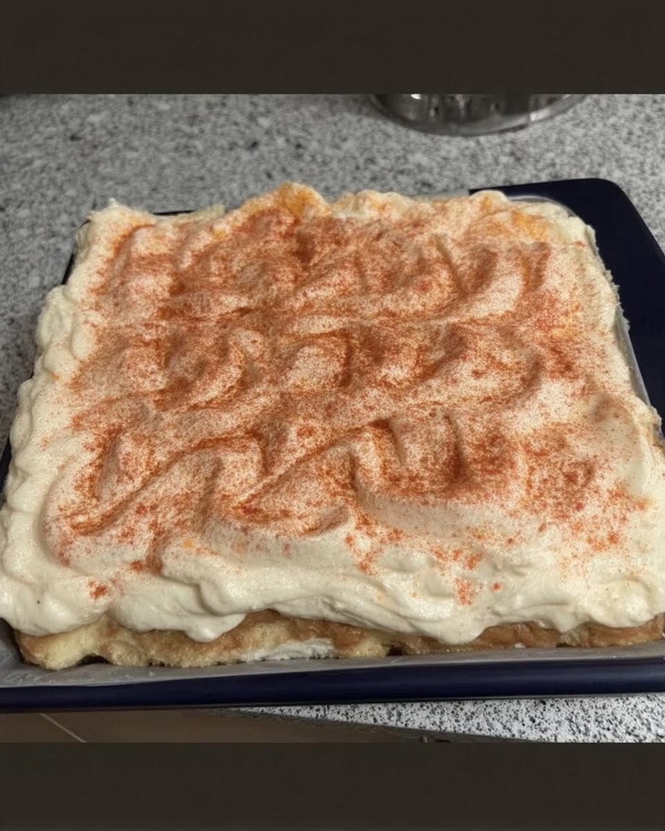 Red velvet spray cake with matte texture on a white stand