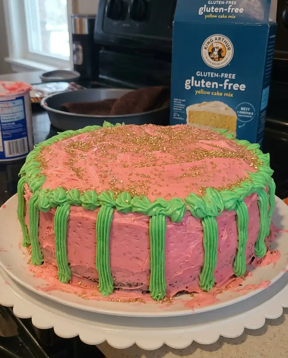 A close up of a sliced christmas themed cake showing the fruit distribution