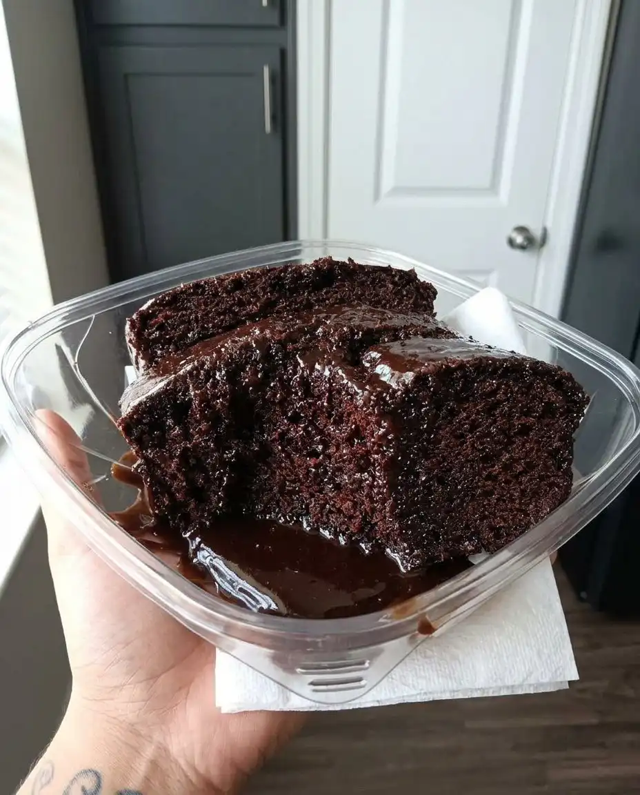 Whisking boiling water into a dark chocolate cake batter