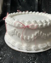 A beautiful heart shaped coquette cake with pink ruffles