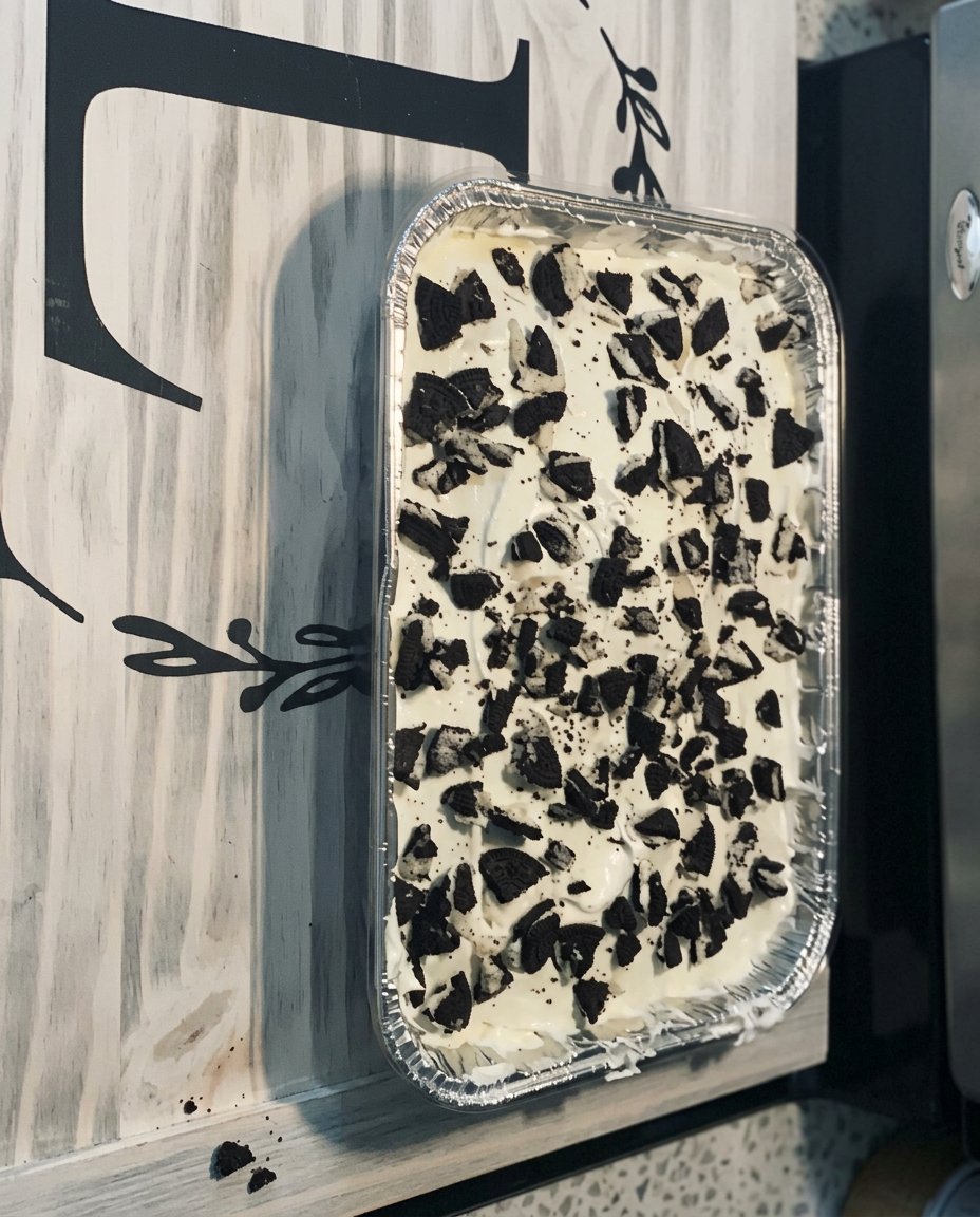 A giant golden brown cookie cake loaded with dark chocolate chunks and pecans