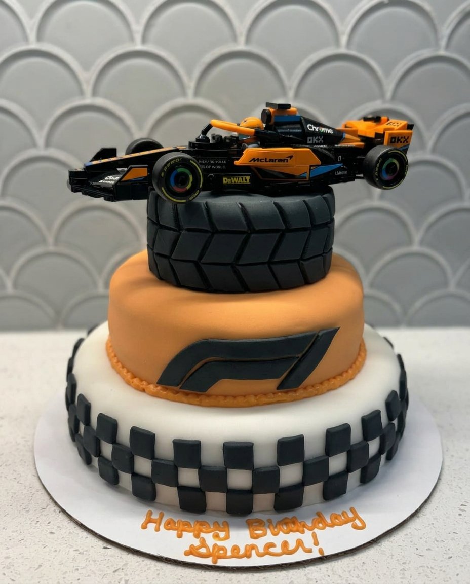 A slice of F1 cake served on a simple plate.