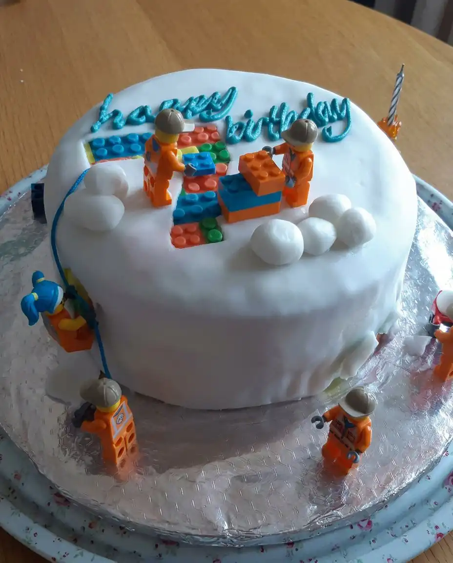 Slices of boys soccer cake served on colorful plates with forks