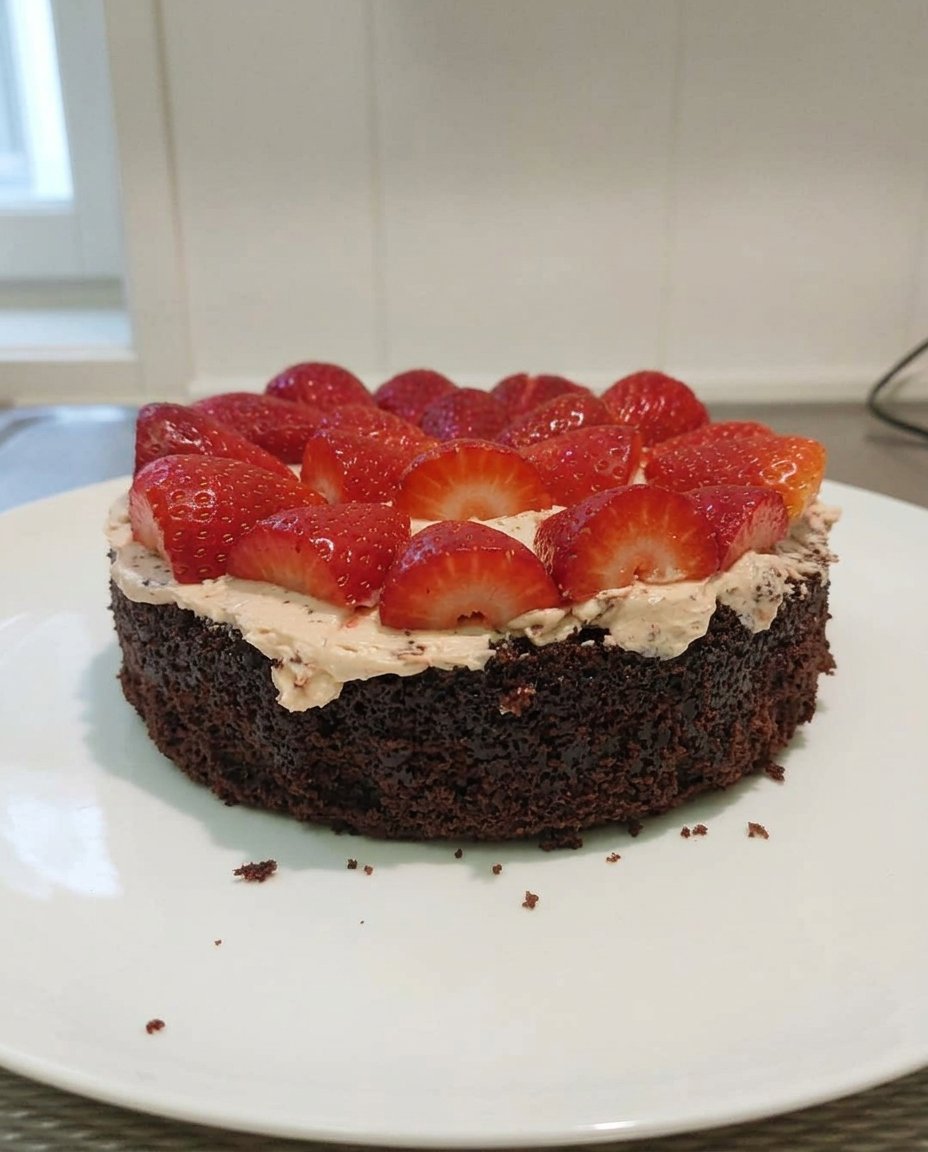 Strawberry Chocolate Cake 13 Sifting cocoa powder into a bowl for a smooth cake batter