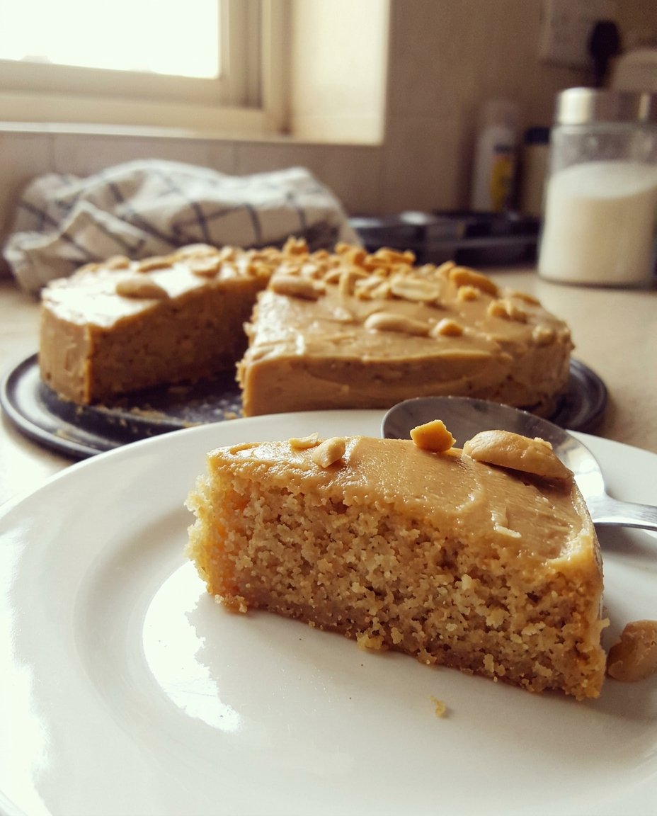 A moist yellow cake made from a box mix sitting on a ceramic plate.
