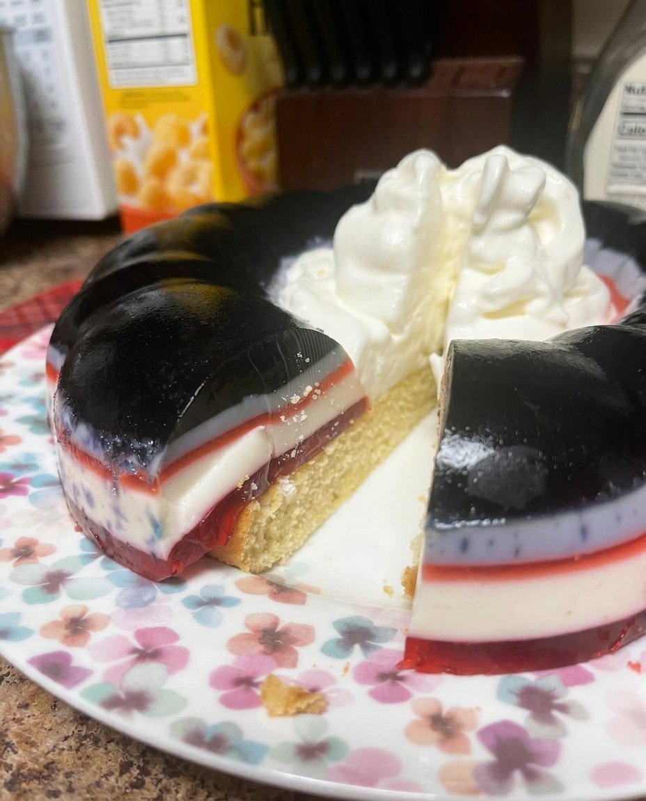 Boxes of strawberry jello fresh strawberries and a can of condensed milk on a counter