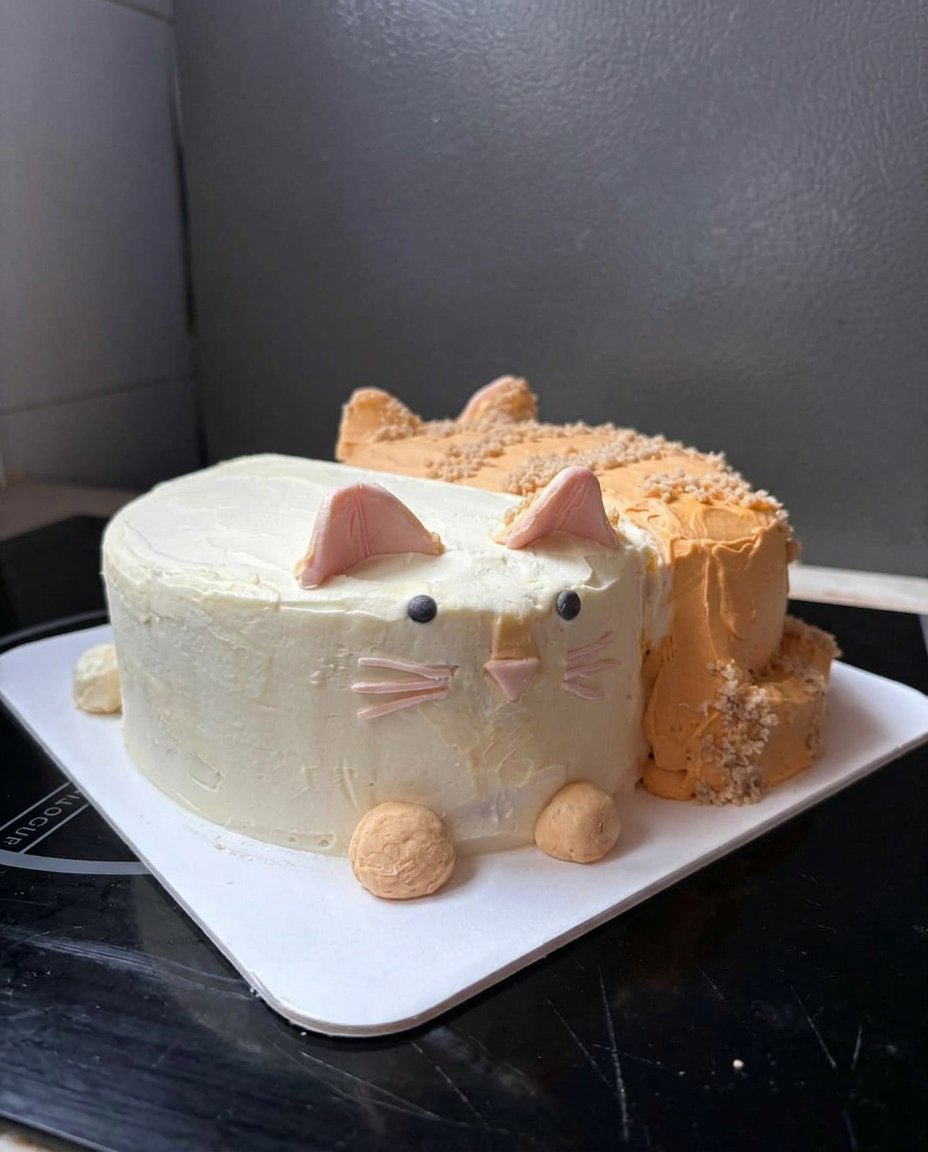 A close up slice of moist chocolate cake with ganache and cereal