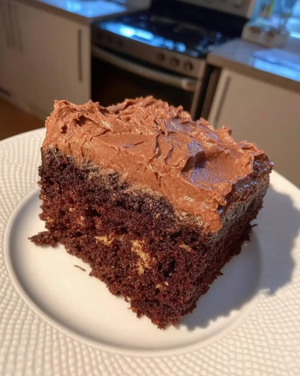 A single slice of simple cake on a small dessert plate