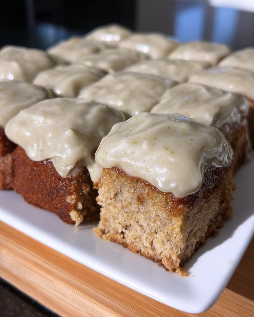 Tres Leches Cake 13 Pouring a creamy milk mixture over a cake with holes poked in it.