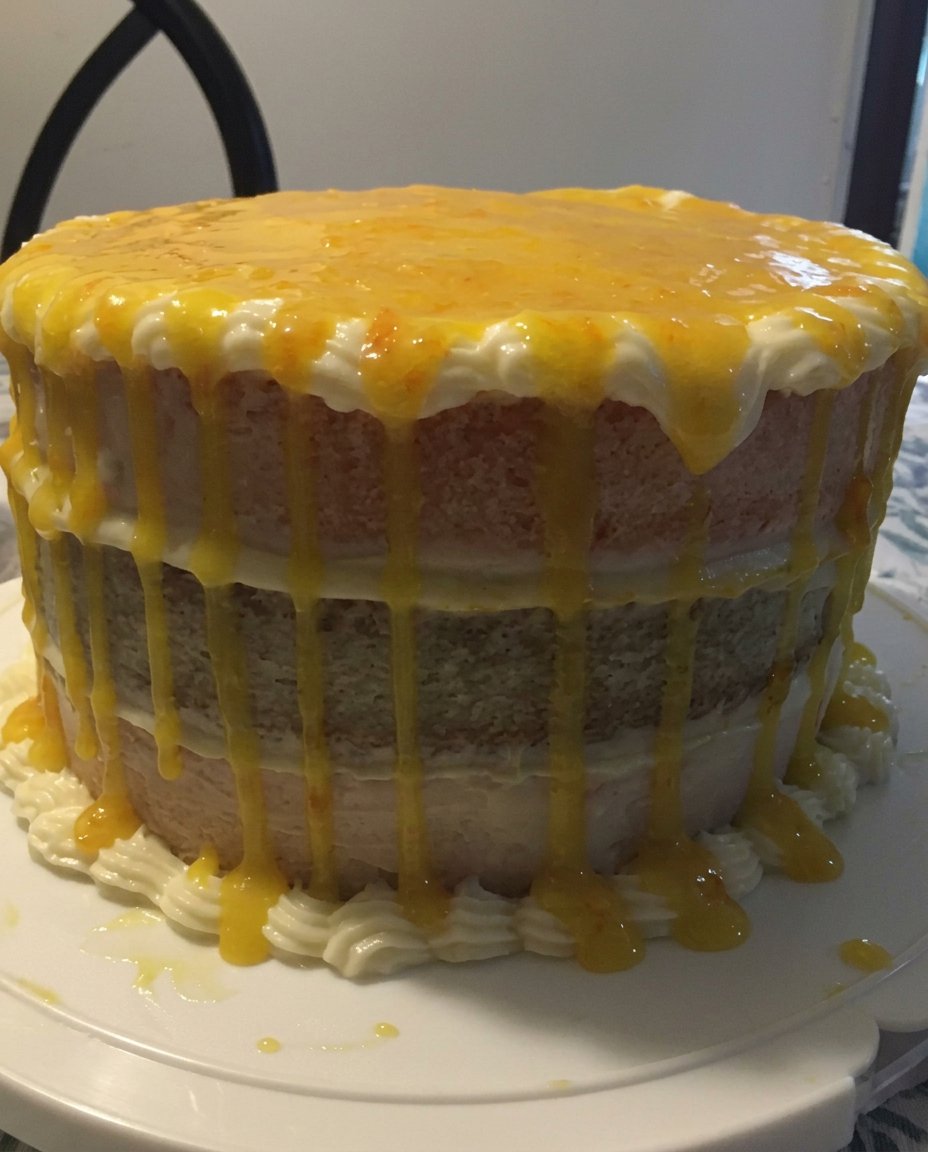 Six small bowls containing different colors of cake batter for a rainbow cake