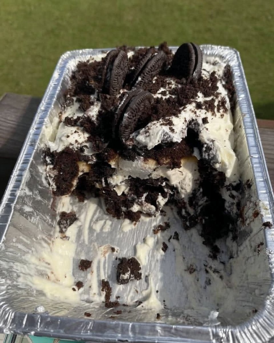 Oreo Icebox Cake 13 Whisking heavy cream with vanilla extract for a cake base