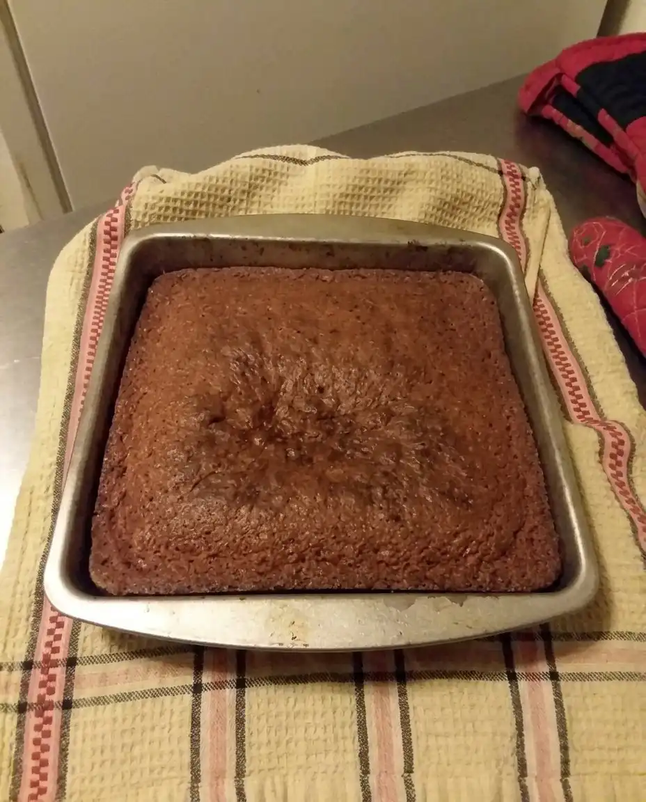 Bananas, butter, sugar, flour, and cinnamon arranged on a kitchen counter