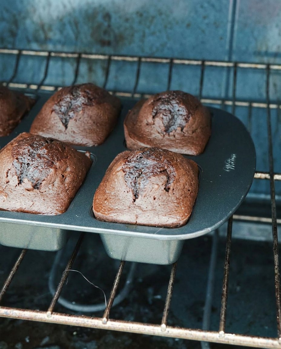 Ingredients for chocolate strawberry cake including box mix and frozen berries