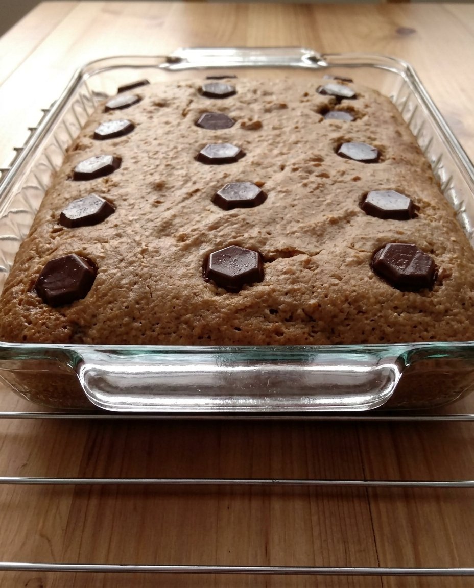 Cutting cold butter into brown sugar and flour with a pastry blender
