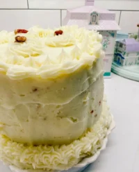 Beautifully decorated fake bake cake using grocery store ingredients with strawberries and cream flavor