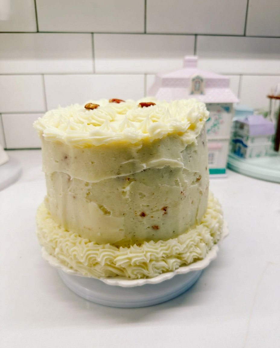 A generous slice of fake bake cake decorated with sprinkles and a strawberry swiss roll