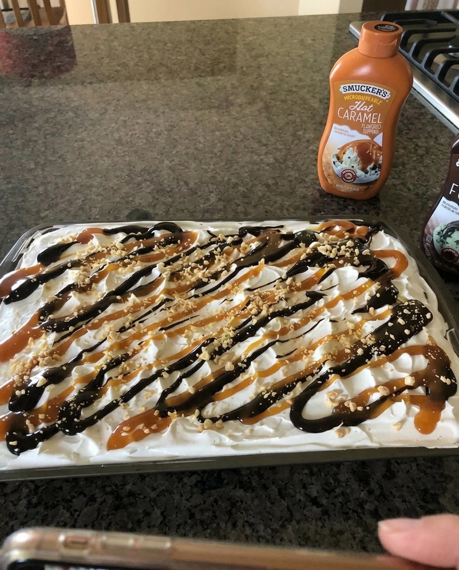 Ice Cream Sandwich Cake 13 A sharp knife cutting through a frozen ice cream sandwich cake to show the layers