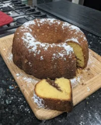 A slice of Sock It To Me Cake showing the beautiful cinnamon pecan swirl in the center