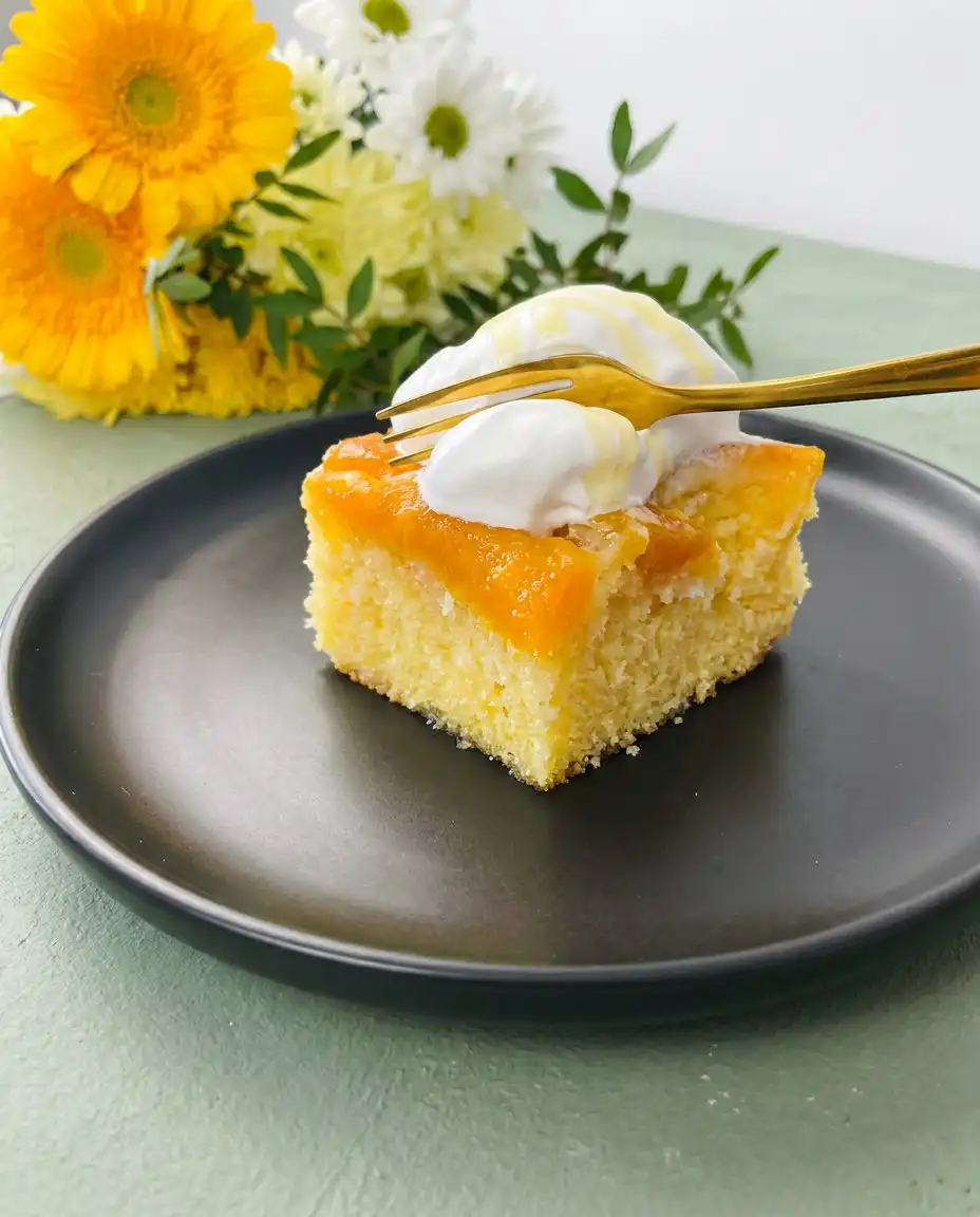Brown Sugar Peach Upside Down Cake 12 A close up shot of a Brown Sugar Peach Upside Down Cake with caramelized fruit topping.