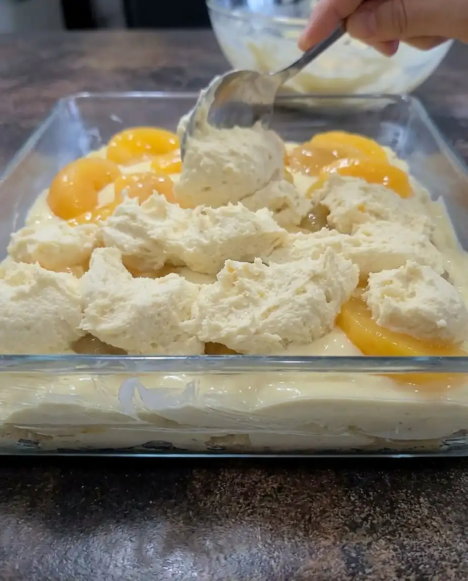 A close up shot of Peaches and Cream Bars showing the fruit and cheesecake layers clearly.