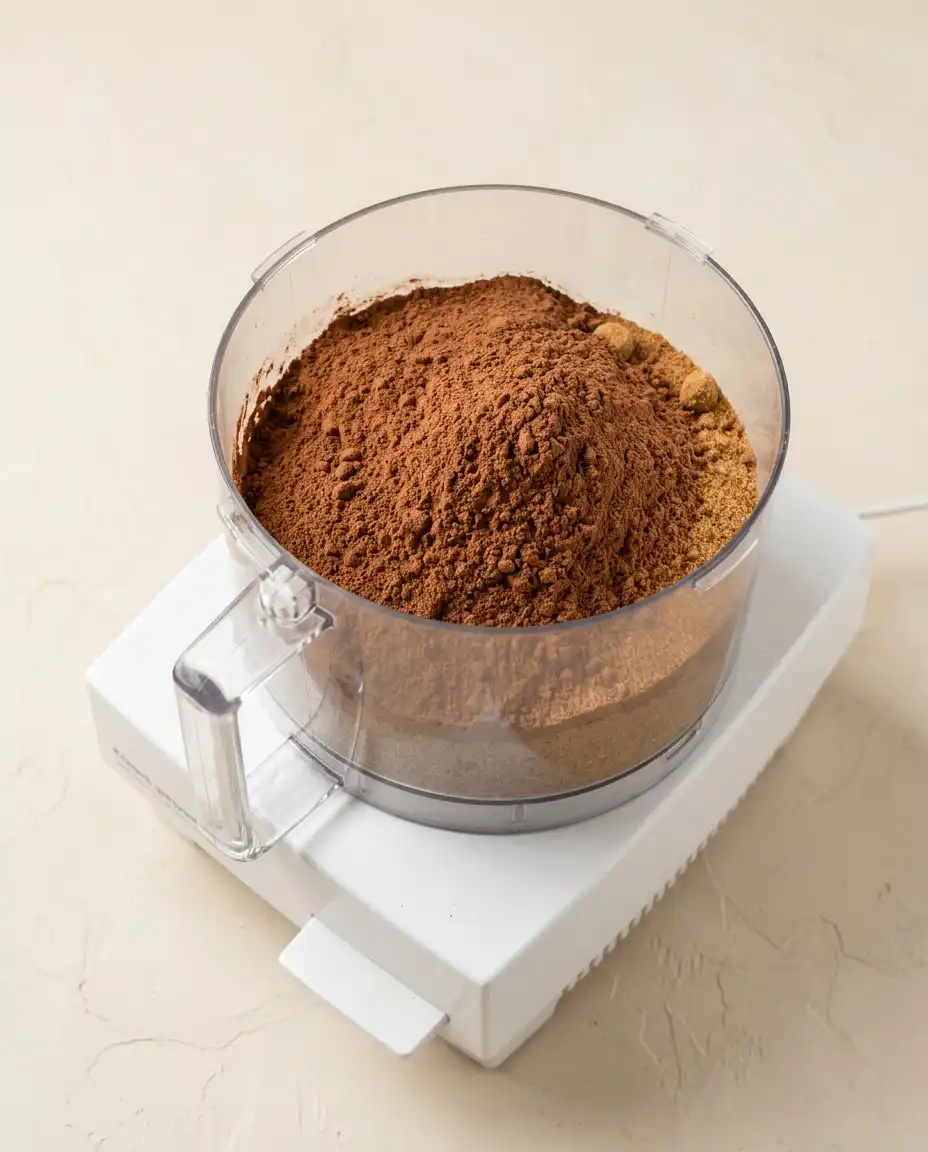 Dairy-Free Chocolate Zucchini Cake 14 Bowls of freshly grated zucchini and dark cocoa powder ready for a dairy-free chocolate zucchini cake.